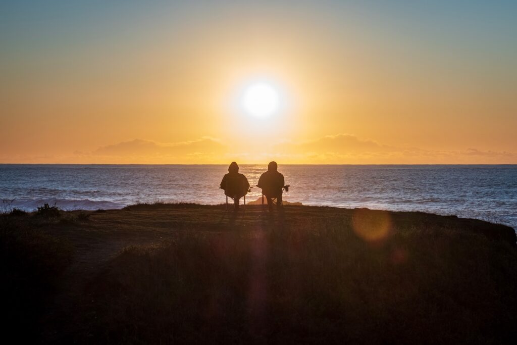 Getting a head start: retirement planning attitudes in 2023 8 two people sitting on seashore