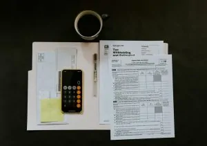 Inheritance Tax Planning 7 A stack of papers, a prone and a cup of coffee